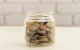 Image of coins in a glass jar.